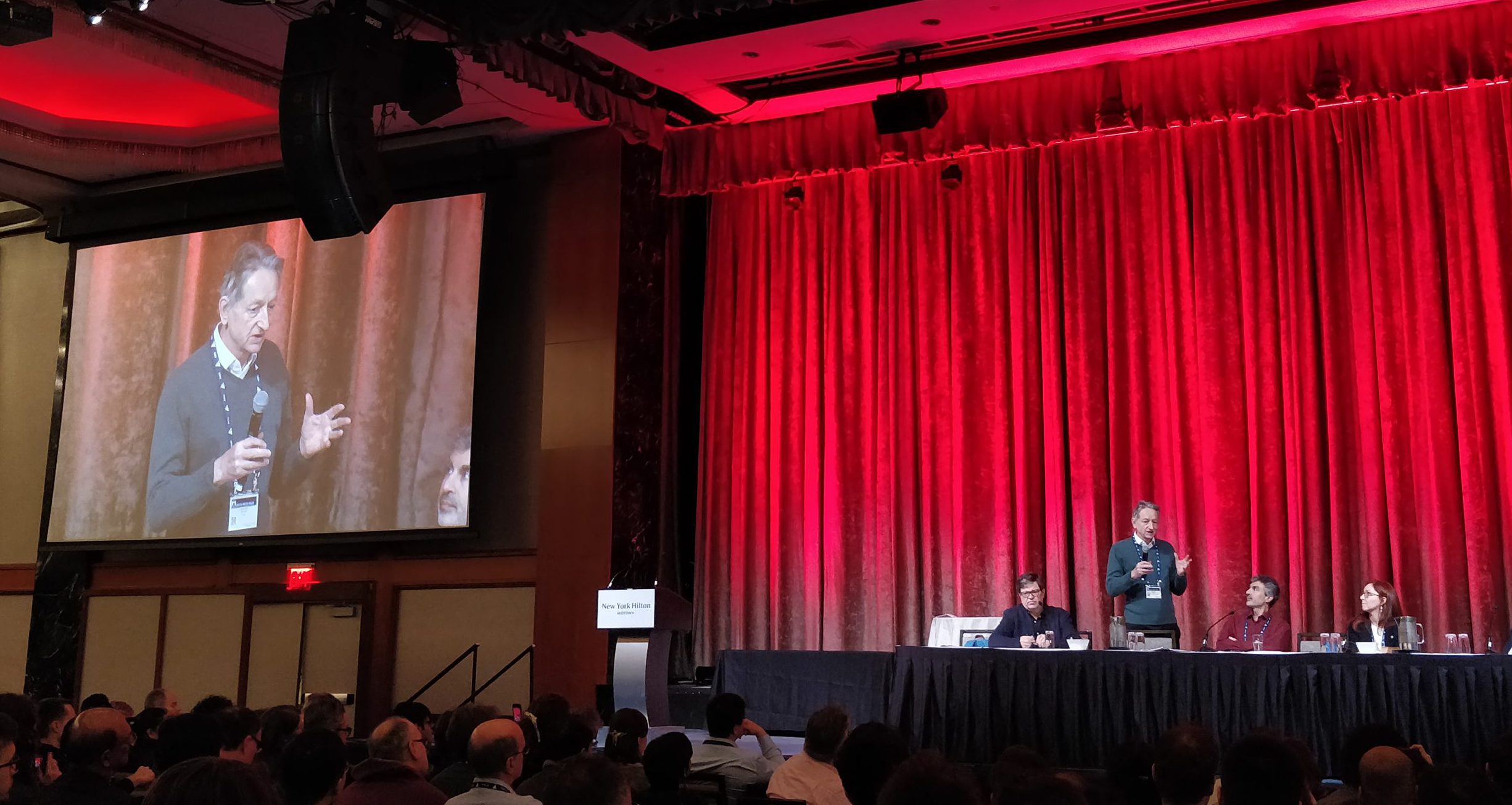 A conference panel of Turing Award laureates on stage at AAAI 2020