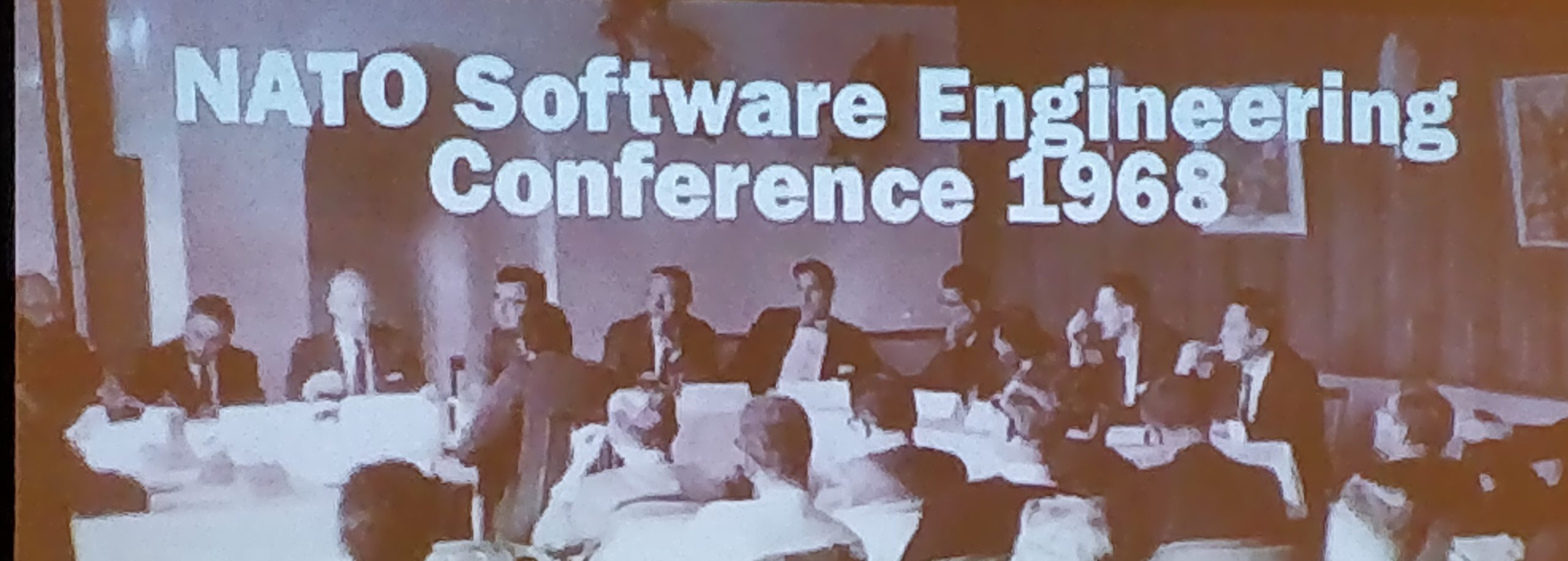 A conference slide reading "NATO Software Engineering Conference 1968" shown above a photograph of the historic panel