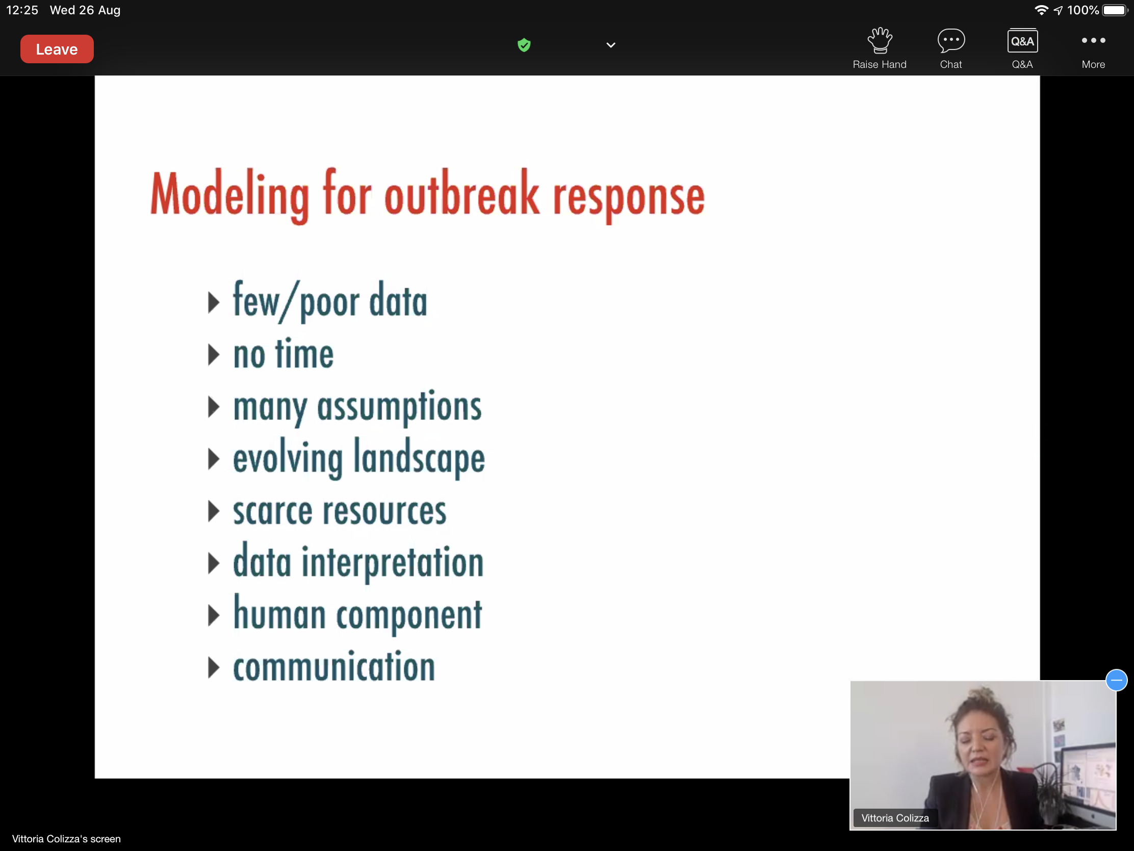 Conference slide titled "Modeling for outbreak response", listing the difficulties it faces: few or poor data, no time, many assumptions, an evolving landscape, scarce resources, data interpretation, the human component, and communication.